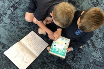 Two-boys-using-iPad