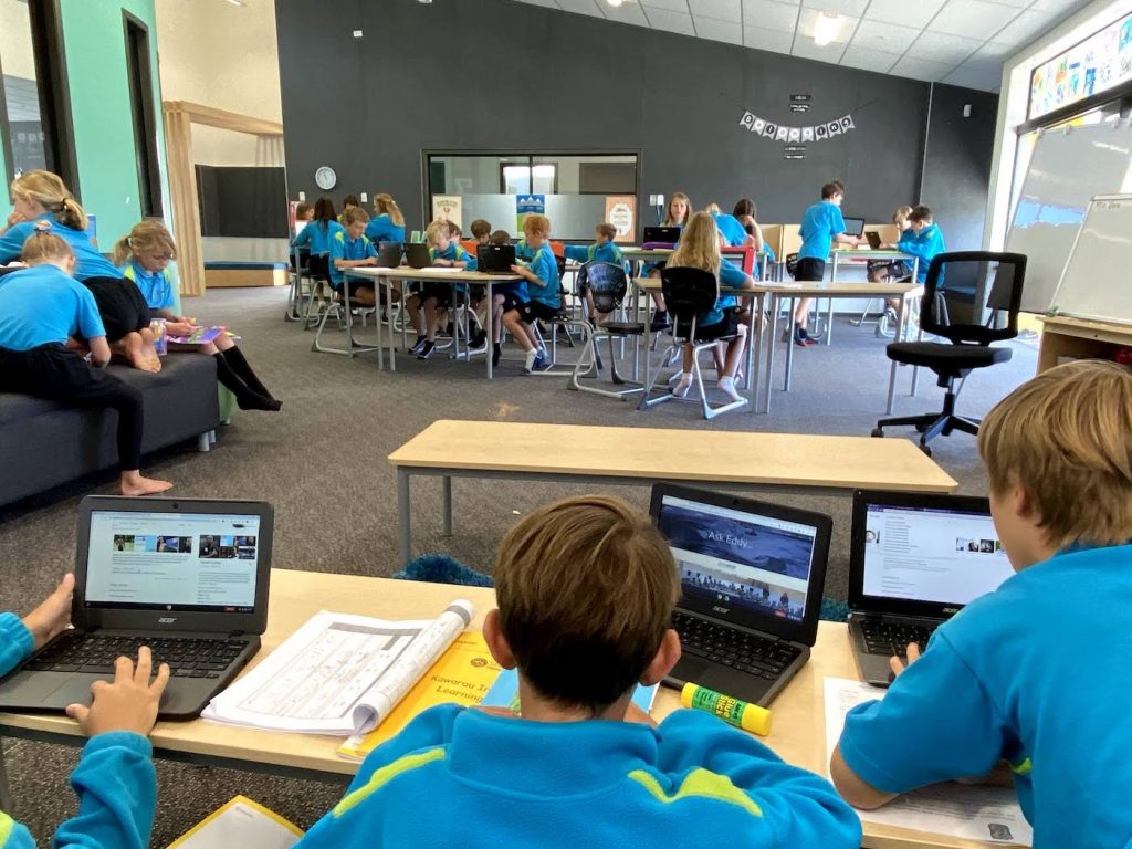 Photo of students with laptops