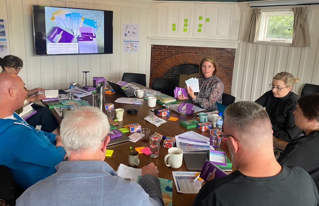 Lady Sharing Cards At A Meeting